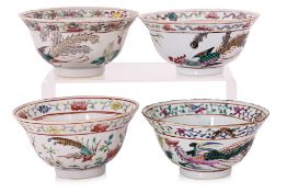 A GROUP OF FOUR FAMILLE ROSE BOWLS
