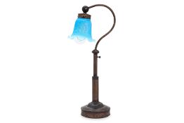 A COPPER BASE LAMP WITH GLASS SHADE