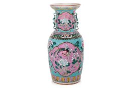 A FAMILLE ROSE TURQUOISE GROUND BALUSTER VASE