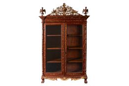 A CARVED AND PARCEL GILT TEAK CABINET (2)