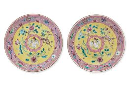 A PAIR OF FAMILLE ROSE YELLOW GROUND SAUCERS