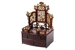 A SMALL GILT AND LACQUERED TABLE CABINET