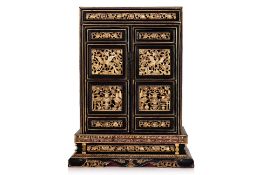 A SMALL GILT AND LACQUERED SHRINE CABINET