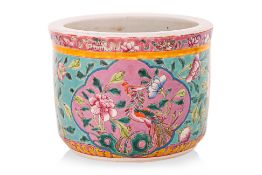 A FAMILLE ROSE TURQUOISE GROUND CENSOR