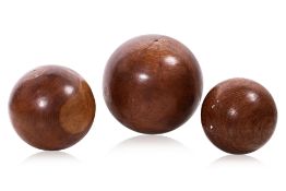 A SET OF THREE DECORATIVE TEAK BALLS