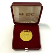 A SINGAPORE 1984 $10 DOLLAR GOLD COIN