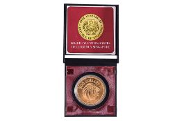 A SINGAPORE $500 1975 10TH ANNIVERSARY GOLD COIN