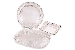 A GROUP OF SILVER PLATED SERVING TRAYS