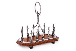 A VICTORIAN SILVER PLATED AND OAK TOAST RACK