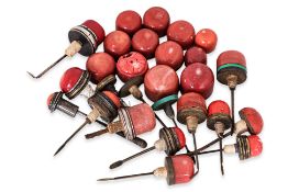 A GROUP OF 24 RED CORAL SNUFF BOTTLE STOPPER TOPS