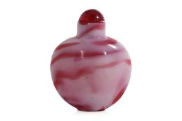 AN OPAQUE WHITE AND WATERMELON-PINK GLASS SNUFF BOTTLE