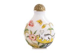A RELIEF DECORATED FAMILLE ROSE ENAMELLED OPAQUE WHITE GLASS 'CAT AND BUTTERFLY' SNUFF BOTTLE