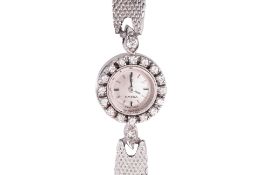 AN OMEGA LADIES DIAMOND SET COCKTAIL WATCH