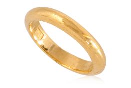A HIGH KARAT GOLD WEDDING BAND