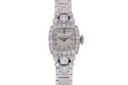 A MOVADO LADY'S DIAMOND SET COCKTAIL WATCH