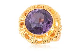 A SYNTHETIC SAPPHIRE HIGH KARAT GOLD RING