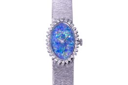 A CHOPARD LADIES WHITE GOLD AND DIAMOND COCKTAIL WATCH WITH OPAL DIAL