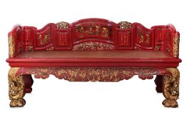 A RED LACQUERED AND GILT DAYBED