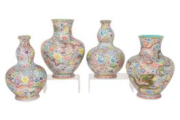 TWO PAIRS OF FAMILLE ROSE MILLEFLEURS DRAGON VASES