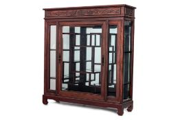 A GLAZED HARDWOOD DISPLAY CABINET