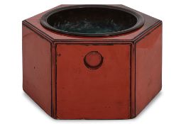 A JAPANESE HEXAGONAL RED LACQUER HIBACHI
