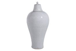 A LARGE WHITE GLAZED MEIPING JAR AND COVER