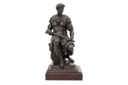 A LARGE BRONZE FIGURE OF GIULIANO DE MEDICI AFTER THE MODEL BY MICHELANGELO
