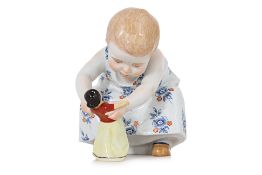 A MEISSEN PORCELAIN FIGURE OF A GIRL DANCING WITH A DOLL