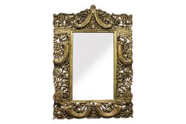 A LARGE CARVED AND GILT MIRROR