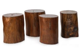 A SET OF FOUR HARDWOOD DRUM STOOLS