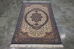 A TABRIZ DESIGN WOOL RUG (273 x 178cm)
