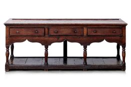 A GEORGIAN WELSH ELM POT BOARD DRESSER