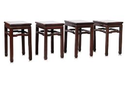 A SET OF FOUR HARDWOOD RECTANGULAR STOOLS