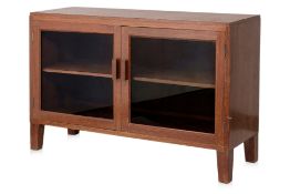 A GLAZED TEAK LOW CABINET