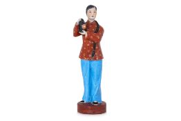A CHINESE PROPAGANDA PORCELAIN FIGURE OF A LADY HOLDING A LANTERN