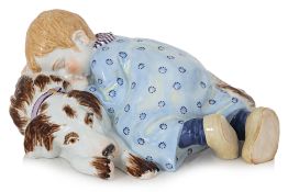 A MEISSEN 'CHILD SLEEPING WITH DOG' PORCELAIN FIGURE