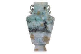 A CARVED JADE TWIN HANDLED VASE