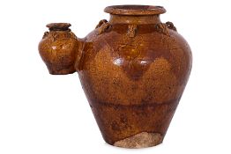A SOUTHEAST ASIAN AMBER GLAZED CONJOINED TWIN JAR