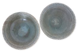 A NEAR PAIR OF LARGE THAI CELADON BOWLS