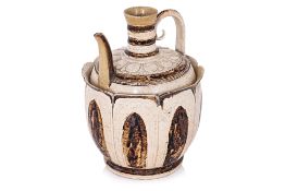 A VIETNAMESE WHITE AND BROWN GLAZED LOTUS FORM EWER