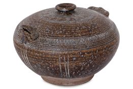A KHMER BROWN GLAZED AND INCISED OWL FORM POT