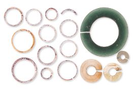 A GROUP OF VIETNAMESE SLIT RINGS AND BRACELET