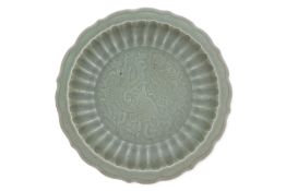 A LARGE CARVED LONGQUAN CELADON DRAGON DISH