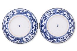 A PAIR OF 'BLEU DE HUE' SHALLOW SAUCER DISHES