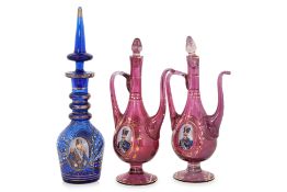 A GROUP OF BOHEMIAN OTTOMAN MARKET GLASS EWERS AND DECANTER