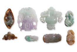 A GROUP OF EIGHT BURMESE JADE CARVINGS
