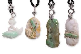 A GROUP OF FOUR BURMESE JADEITE PENDANTS