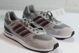 A pair of Adidas Run 80s in Grey Shadow/Red Shadow