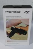 A Hypervolt Go compact percussion massage device.