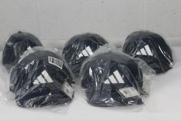 Five Adidas Tour snapback golf caps in navy and wh